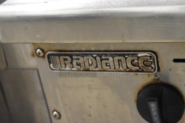 Radiance stainless steel commercial gas-powered griddle, visible wear, Radiance branding label and control knob.