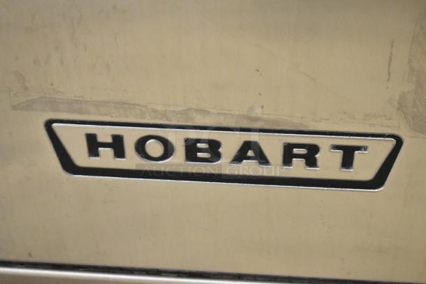 Hobart LXIH stainless steel undercounter dishwasher, commercial-grade. Visible logo label. 120/208 volts, 1 phase.