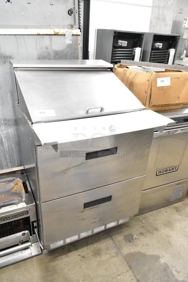 Delfield stainless steel sandwich salad prep table with bain marie mega top, two drawers, on commercial casters, 115V.