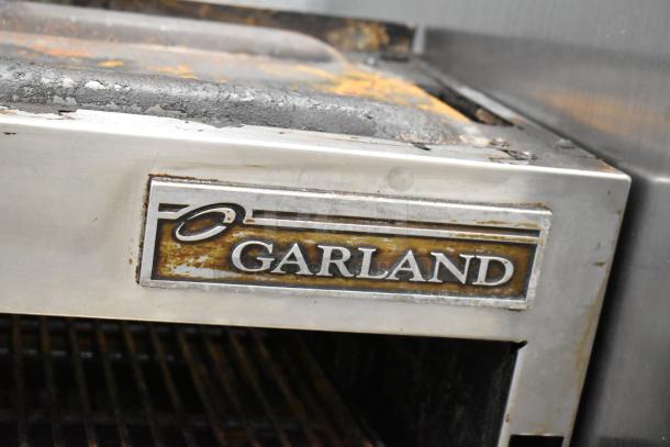 Garland Stainless Steel Commercial Gas Cheese Melter, worn exterior, visible Garland label, suitable for heavy kitchen use.