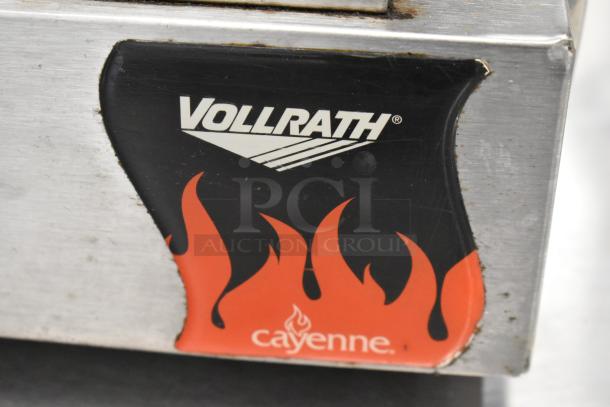 Vollrath Cayenne stainless steel commercial countertop panini press, 120 volts, with logo and flame design.