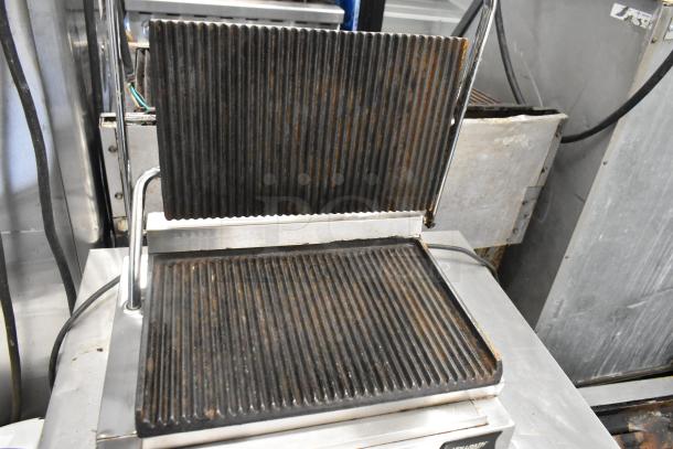 Vollrath Cayenne stainless steel commercial panini press, countertop model, 120 volts, used condition with visible wear.