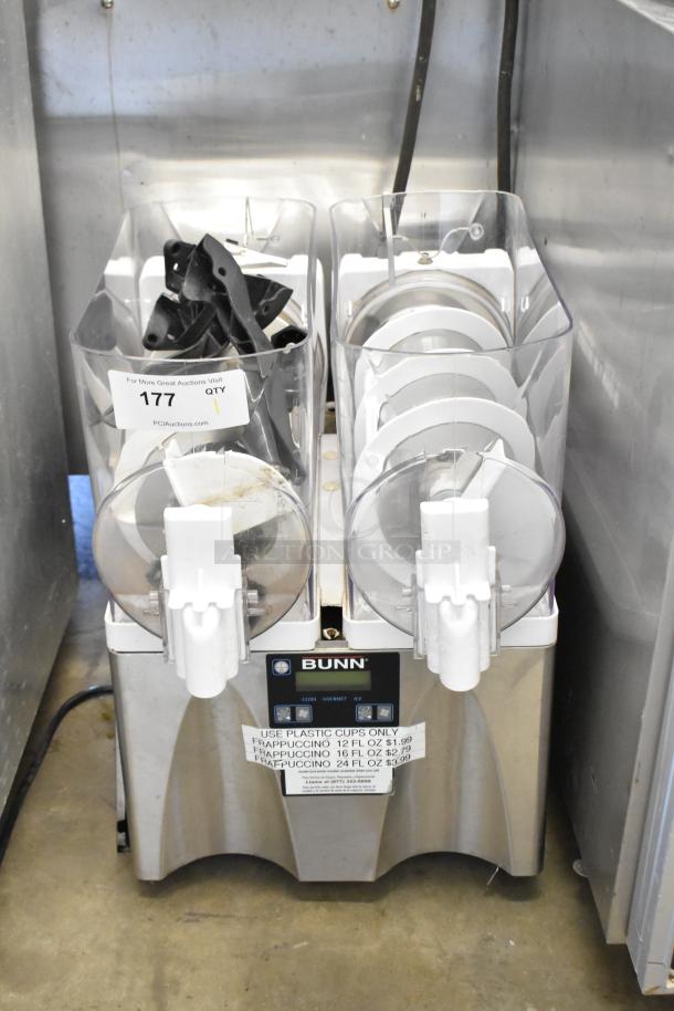 Bunn stainless steel commercial slushie machine with 2 hoppers, no lids. 115 volts, 1 phase. Slight wear, visible pricing label.