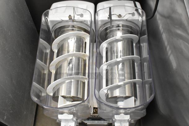 Bunn stainless steel commercial slushie machine, 2 hoppers, no lids, 115 volts, 1 phase, countertop model, used condition.