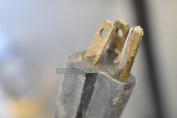 Bunn stainless steel 2-hopper slushie machine, no lids, 115 volts, 1 phase. Close-up of electrical plug with wear visible.