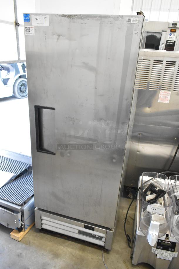2017 True T-12-HC stainless steel commercial cooler. Single door, reach-in model, 115 volts, 1 phase. Exterior wear visible.