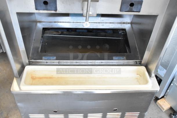Taylor 342D-27 stainless steel 2-flavor frozen beverage machine, air-cooled, on commercial casters, label indicates "For Fruit Use Only."