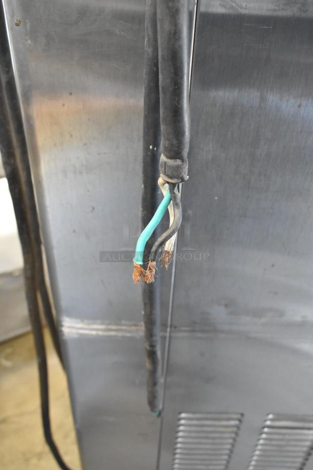 Taylor 342D-27 stainless steel frozen beverage machine, visible frayed wires, commercial casters, requires repair.
