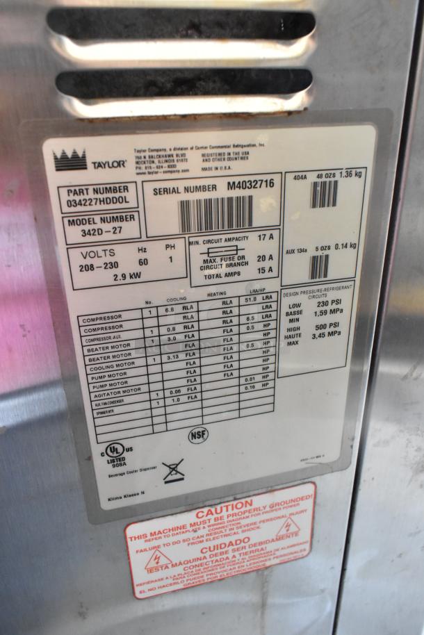 Taylor 342D-27 Frozen Beverage Machine label showing specs: 208-230V, 2.9kW, NSF certified, on commercial casters.