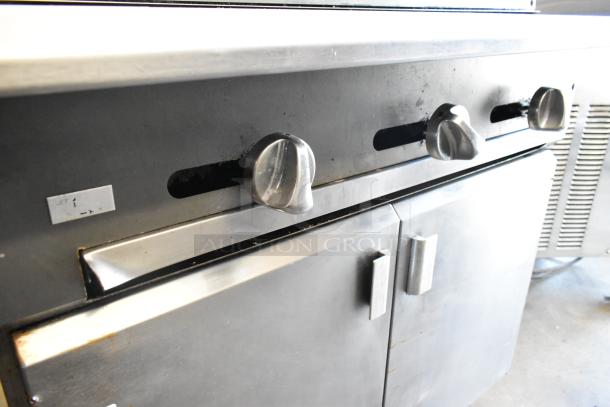 Vulcan VCBB36B stainless steel commercial charbroiler grill, natural gas, 98,000 BTU. Visible control knobs and storage compartments.