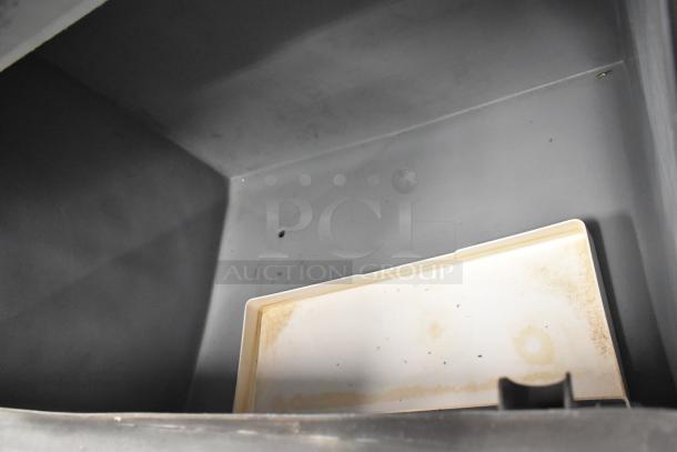 Manitowoc SY1405W ice machine head on B970 bin, stainless steel, 208-230V, 1 phase, visible interior bin detail.