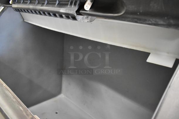 Manitowoc SY1405W stainless steel ice machine head on B970 bin, 208-230V, 1 phase, shown in good condition, interior view.