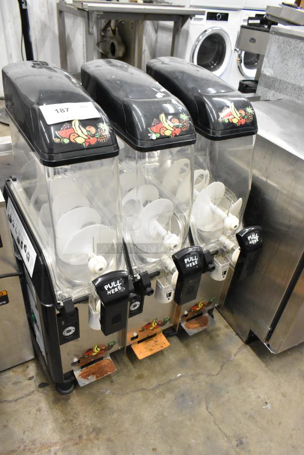 Elmeco FC3 Stainless Steel 3 Hopper Slushie Machine, 115 Volts, 1 Phase. Used, with fruit design and "PULL HERE" labels.