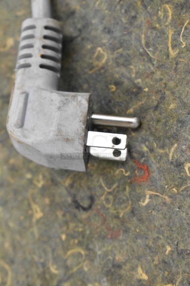 Close-up of a plug from a Miele G4700SCi stainless steel dishwasher. 120 Volts, 1 Phase.
