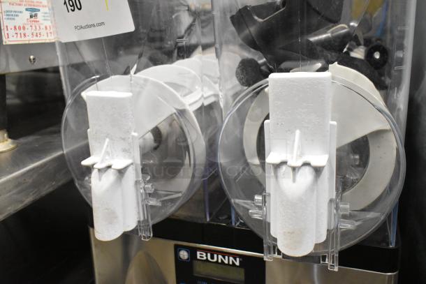 Bunn stainless steel commercial slushie machine with 2 hoppers. Missing lids, visible hopper damage. 115V, 1 phase.
