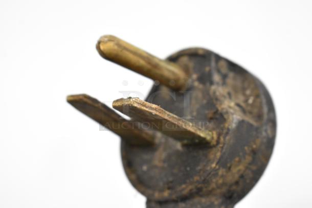 Close-up of a worn electrical plug for a Turbochef NGC Rapid Cook Oven, showing visible wear and tarnish.
