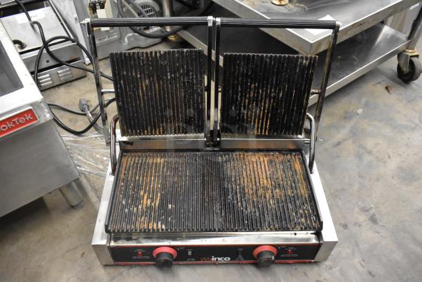 Winco EPG-2 Stainless Steel Double Panini Press, ribbed plates, used condition, 120V, suitable for commercial use.