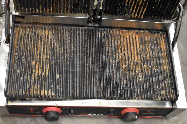 Winco EPG-2 Stainless Steel Double Panini Press, 120 Volts, used condition with visible wear on griddle surfaces.