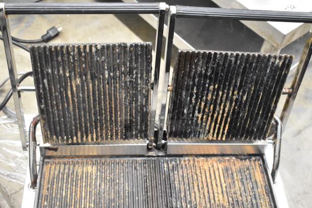 Winco EPG-2 stainless steel double panini press, used condition, visible signs of wear on grill plates, 120V, 1 Phase.