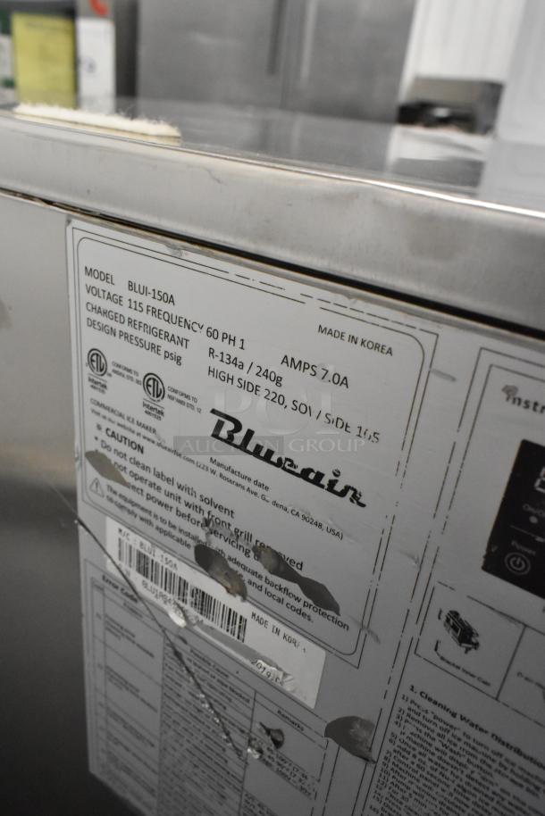 Blue Air BLUI-150A commercial ice machine, 115V, 1 phase, stainless steel. Label shows model details and usage instructions.