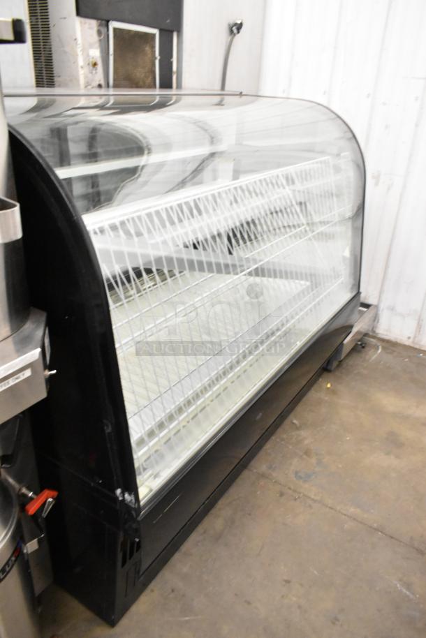 Metal commercial dry display case merchandiser, floor style, features multiple wire shelves, glass front, good condition.