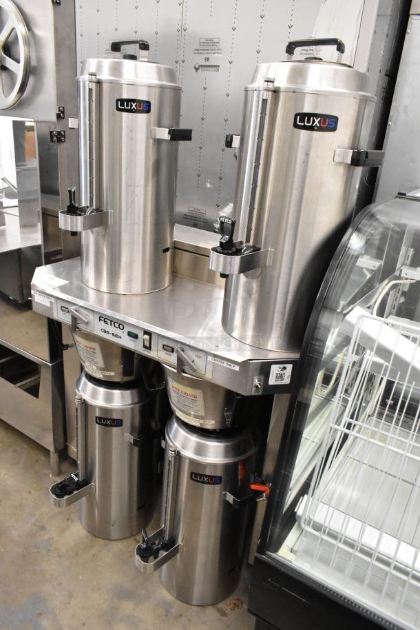 Fetco CBS-62H stainless steel double coffee machine with hot water dispenser, 2 brew baskets, and 4 satellite servers.
