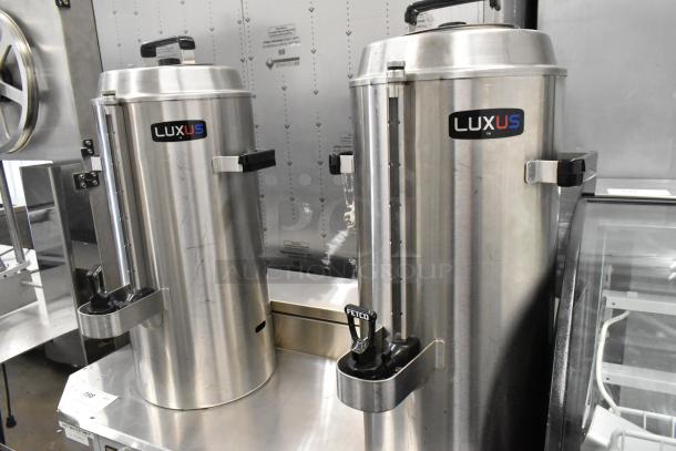 Fetco CBS-62H stainless steel coffee machine with hot water dispenser, 2 brew baskets, 4 satellite servers; model shown on countertop.