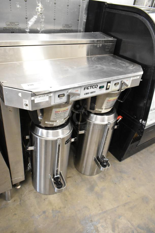 Fetco CBS-62H stainless steel commercial double coffee machine with hot water dispenser, brew baskets, and satellite servers.