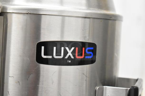 Fetco CBS-62H stainless steel coffee machine with "Luxus" label, featuring double brew system and hot water dispenser.