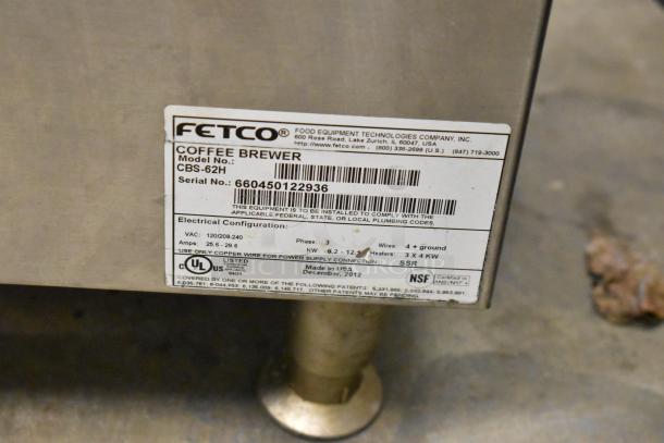 Fetco CBS-62H stainless steel coffee machine with hot water dispenser, 2 brew baskets, and 4 servers. Power: 120/208-240V, 1 phase.