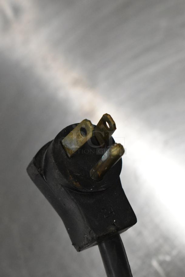 Power plug close-up of a Beverage Air BB72 commercial cooler, 115 volts, 1 phase. Black, three-prong design.
