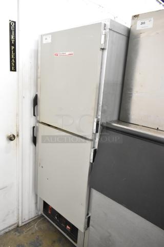 Metro FlavorHold C199 metal heated holding cabinet with commercial casters. Visible labels indicate model and features. Good condition.