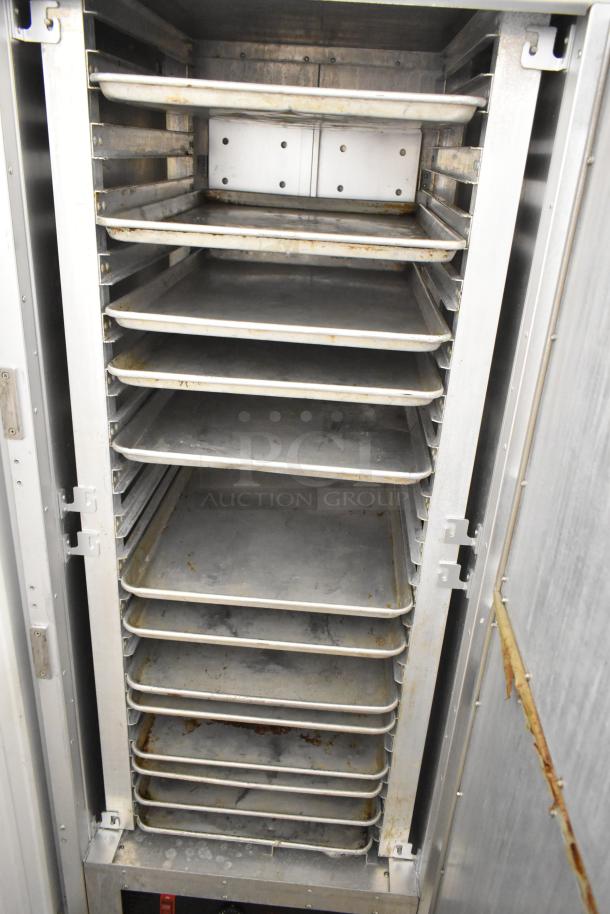 Metro FlavorHold C199 metal commercial heated holding cabinet with commercial casters, multiple shelves, good used condition.