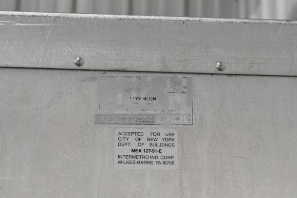Metro FlavorHold C199 heated holding cabinet, commercial casters, metal construction, label states NYC Dept. of Buildings approval.