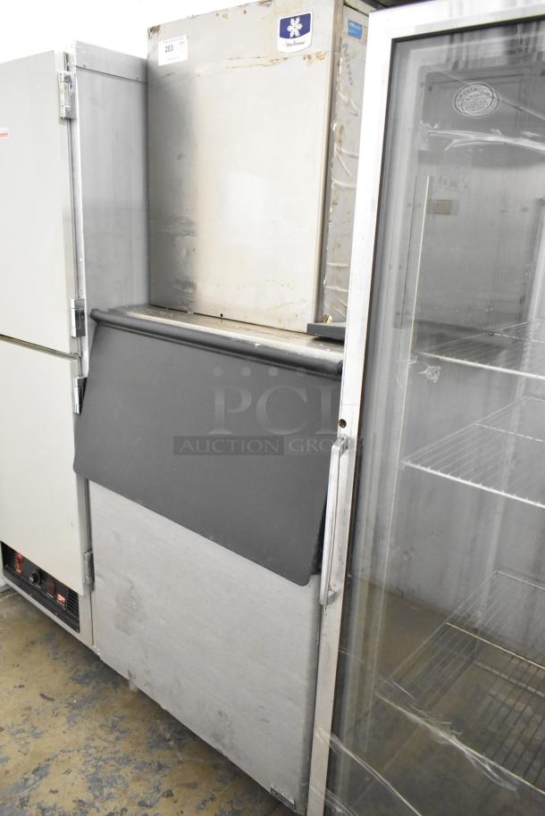 Manitowoc RFS0300A stainless steel commercial ice head on bin, 115V, 1 phase, durable, signs of use, ideal for businesses.