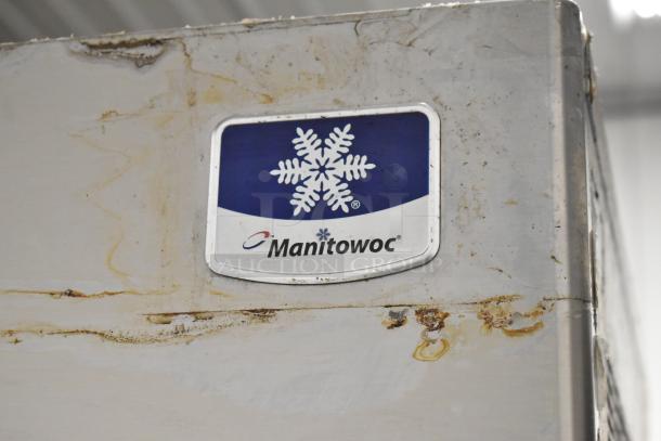 Manitowoc RFS0300A stainless steel ice head on bin, 115V, 1 phase. Visible wear and rust near the Manitowoc logo.