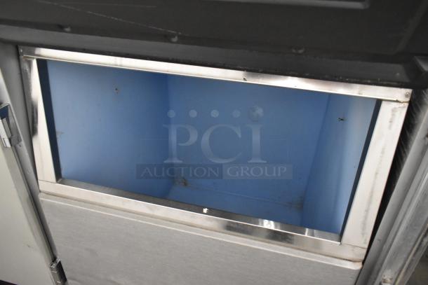Manitowoc RFS0300A stainless steel commercial ice head on bin, 115 volts, 1 phase. Clean interior, sturdy construction.
