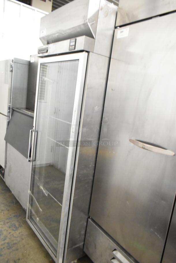 Hobart Q1 stainless steel single door reach-in cooler with glass door, poly coated racks, and visible Hobart branding.