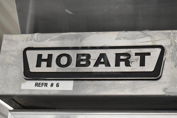 Hobart Q1 stainless steel cooler, single door, with poly coated racks. Model tag shows "REFR #6," indicating unit number.