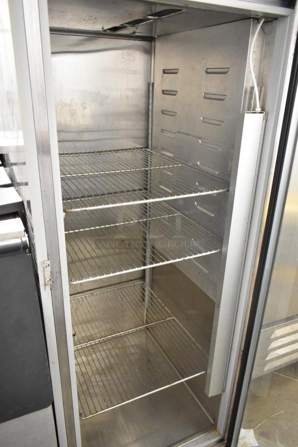 Hobart Q1 stainless steel single door cooler, poly-coated racks, commercial use. Clean interior, minor wear visible.