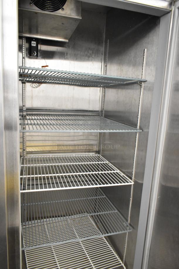 Beverage Air HBF49-1 stainless steel commercial 2-door freezer with poly-coated racks, on commercial casters.