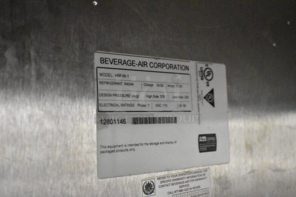 Stainless steel Beverage Air HBF49-1 commercial freezer label, showing model details including refrigerant and electrical ratings.