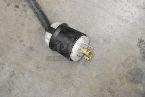 Power plug for Bunn IMIX-5 cappuccino machine, 120/208-240 volts, 1 phase, shown on a concrete surface.