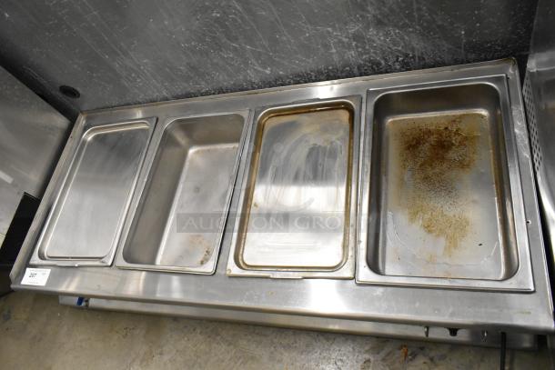 Stainless steel 4-well electric steam table, countertop model, used condition, previously hardwired, visible wear on wells.