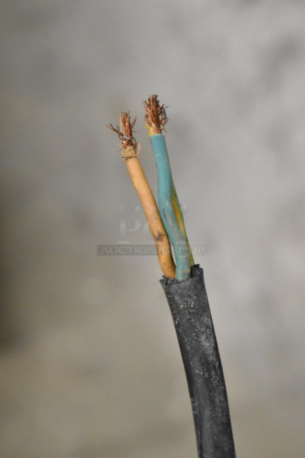 Frayed electrical cord with exposed copper wires from the stainless steel commercial countertop steam table.