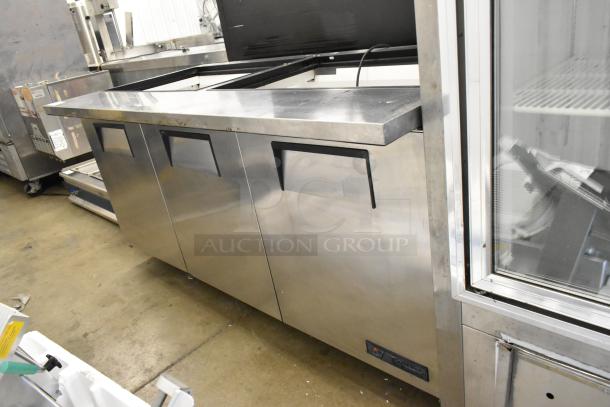 True TSSU-72-30M-B-ST stainless steel prep table, missing lid, on casters. Model plate visible, powered at 115V, 1 phase.