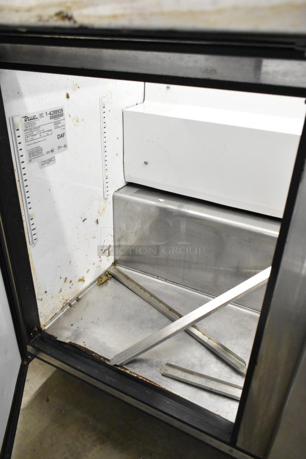 True TSSU-72-30M-B-ST stainless steel sandwich salad prep table with missing lid. Visible label indicating model and specs.