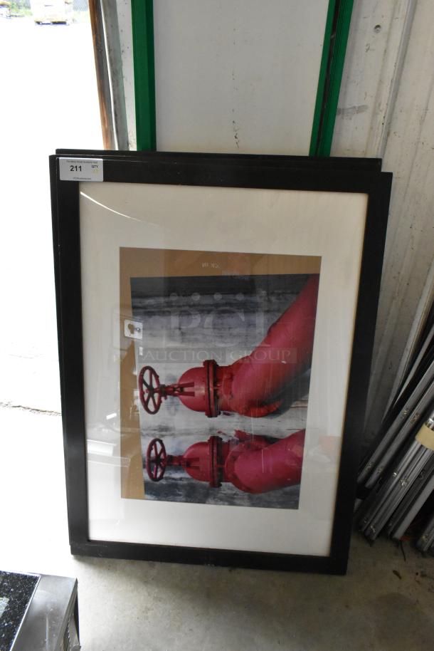 Framed picture featuring red valves, black frame, minor wear. Auction tag reads "211, Qty 3, PCGAuction." Part of a 5-item lot.