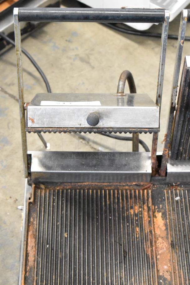 Cecilware Stainless Steel Commercial Double Panini Press, 208V, 1 Phase. Shows visible wear and rust on the grill plates.
