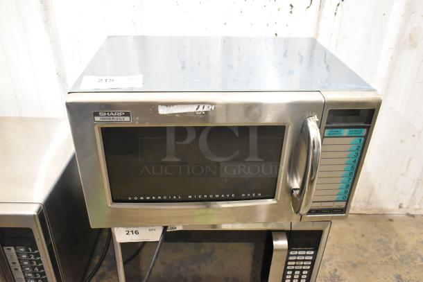 Sharp stainless steel commercial countertop microwave oven. 1000W R-21LV model. Handle broken; door cannot open.